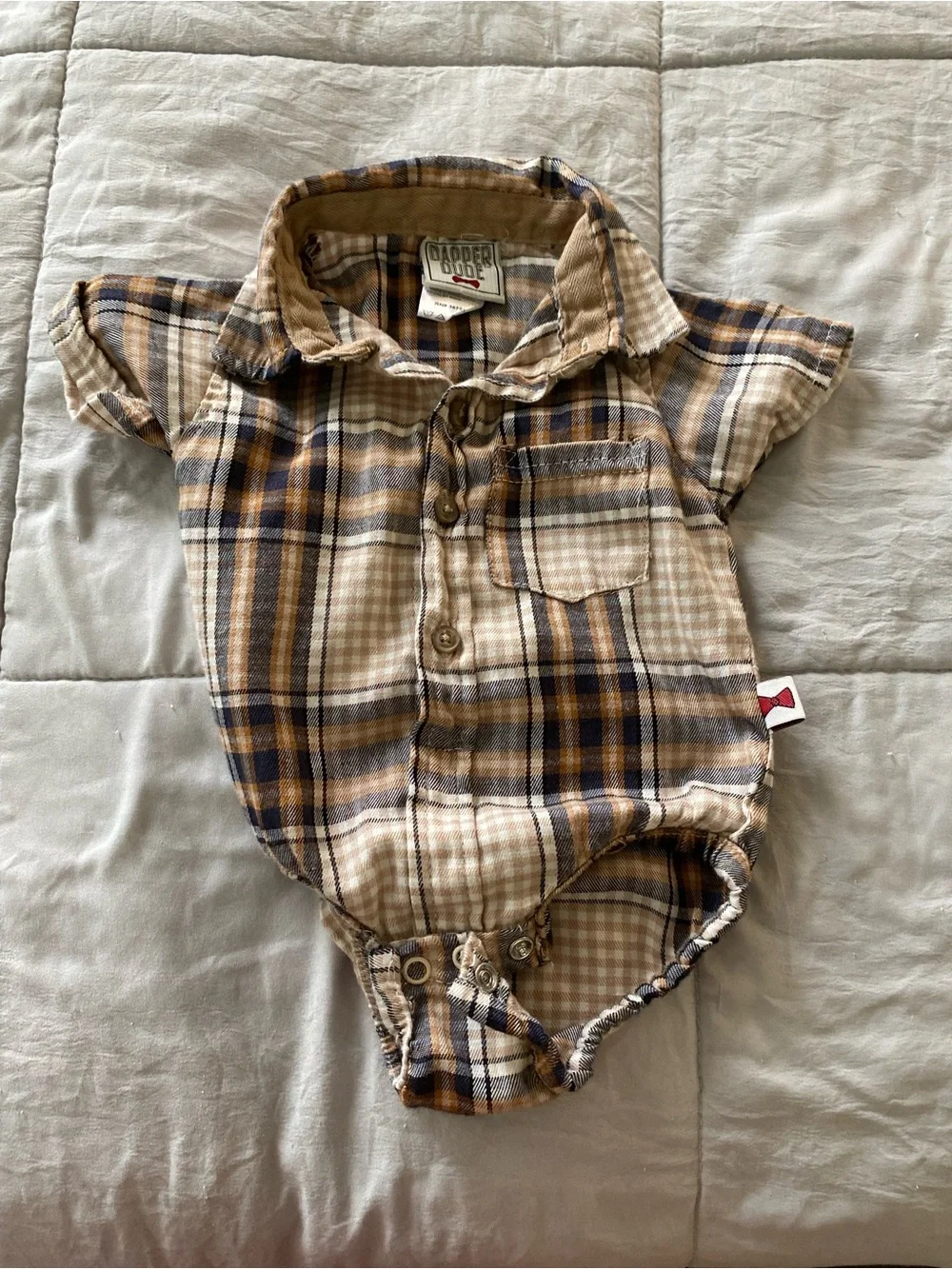 Calvin Klein Navy & White Striped Baby Onesie with Mixed Neutral Baby Clothing